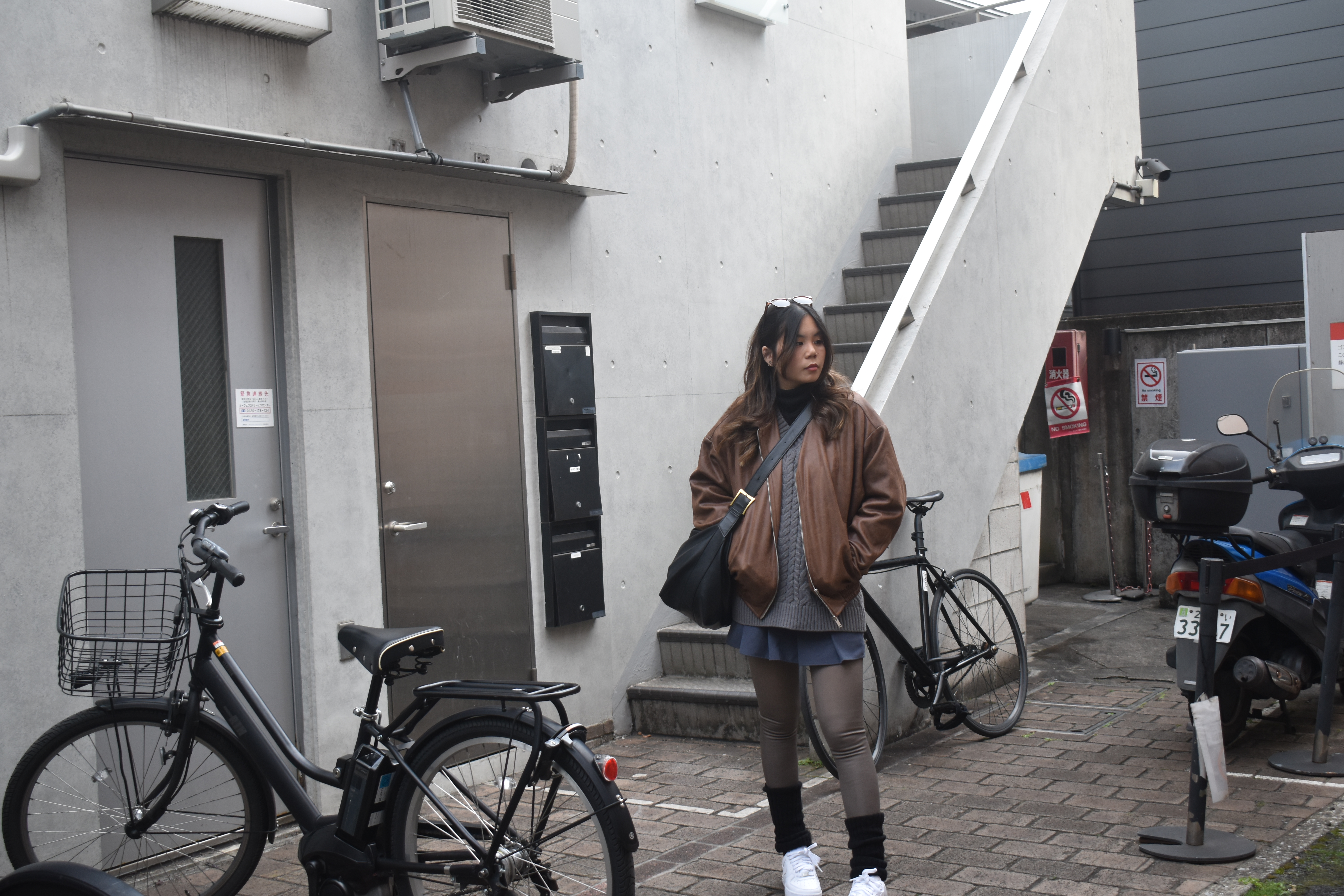 Duana at a staircase with bicycles